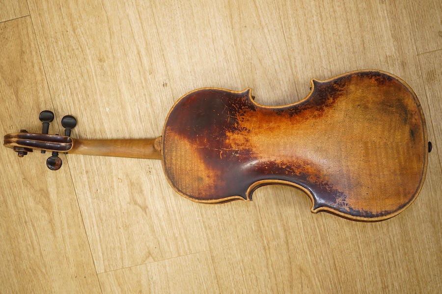 A late 19th century German violin, back measures 36cm. Condition - poor to fair